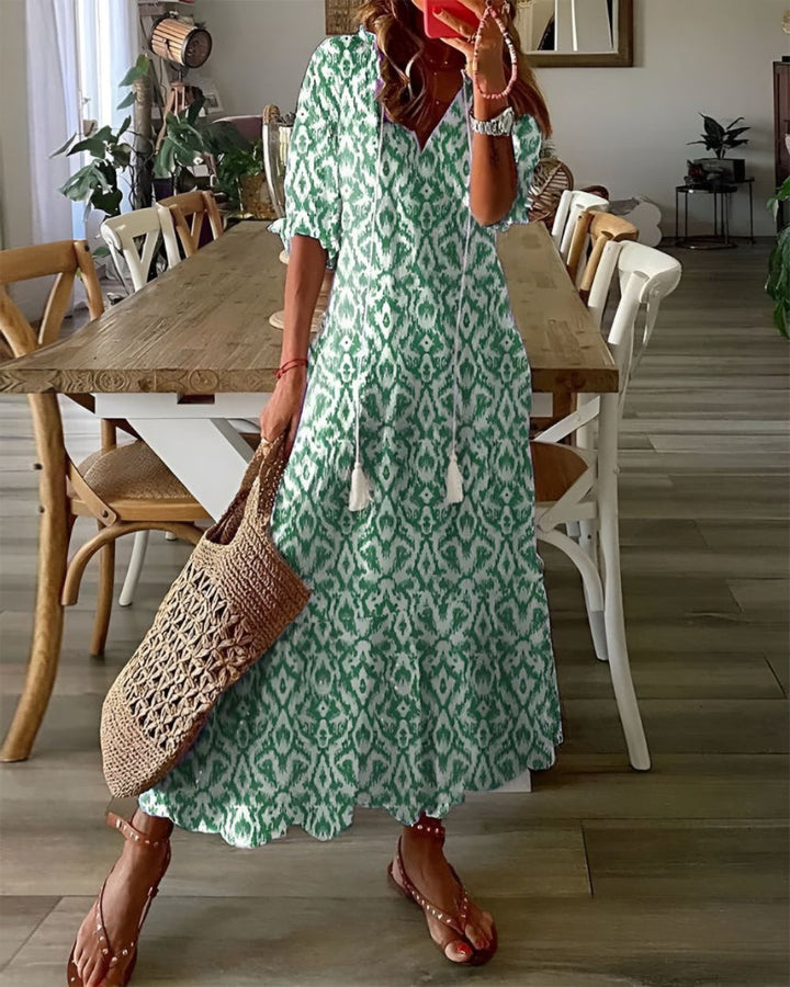 Chelsea | Abito lungo con cravattino e nappe sul davanti